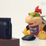 Bowser Jr chơi game trên Nintendo Switch 2 với phụ kiện camera, minh họa tính năng video call và vấn đề an toàn trẻ em