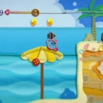 Kirby đứng trên bãi biển trong game Kirby's Epic Yarn, với phong cách đồ họa sợi len độc đáo trên Nintendo Wii