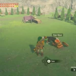 Link đang cho một chú chó ăn tại chuồng ngựa trong The Legend of Zelda: Tears of the Kingdom.