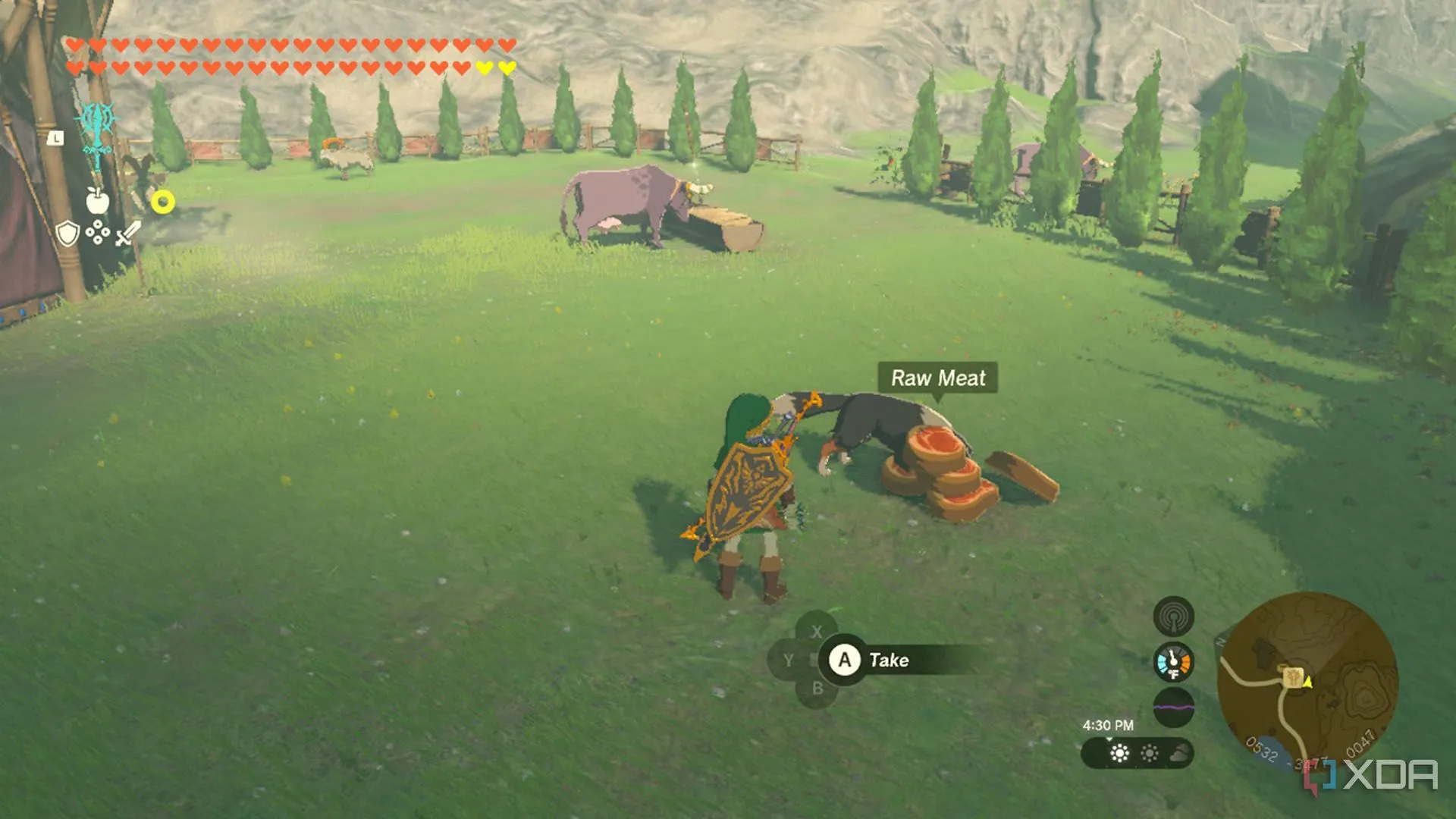 Link đang cho một chú chó ăn tại chuồng ngựa trong The Legend of Zelda: Tears of the Kingdom.