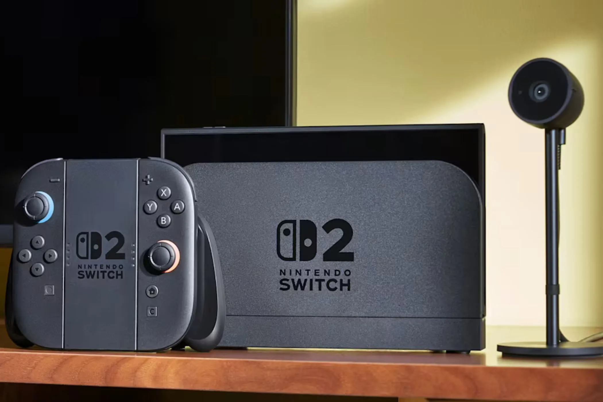 Thẻ game Nintendo Switch 2 màu đỏ và hệ máy console đặt trên bàn