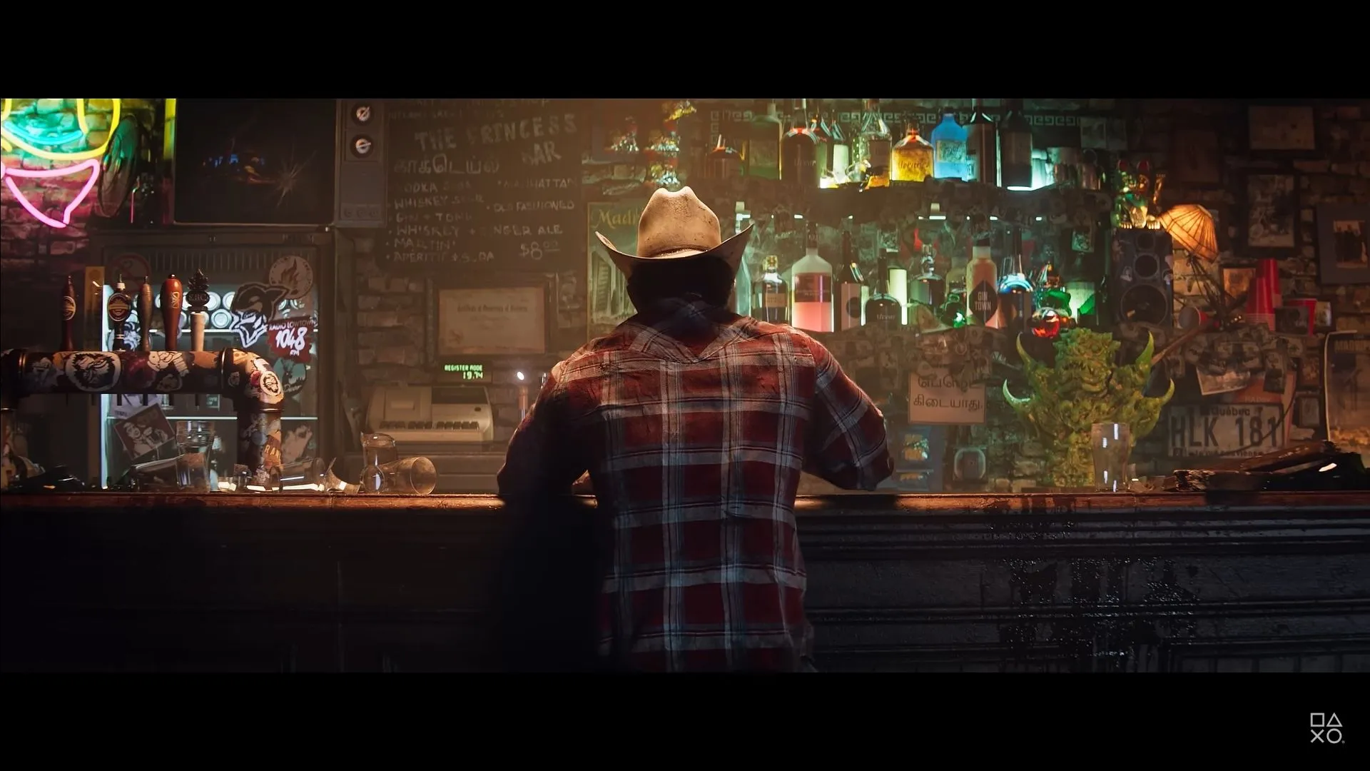 Wolverine ngồi trong quán bar ở Madripoor, một cảnh từ trailer Marvel's Wolverine.
